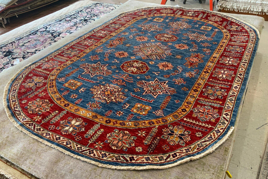 David Tiftickjian and Sons has oval rugs and Kazak rugs for any dining room.
