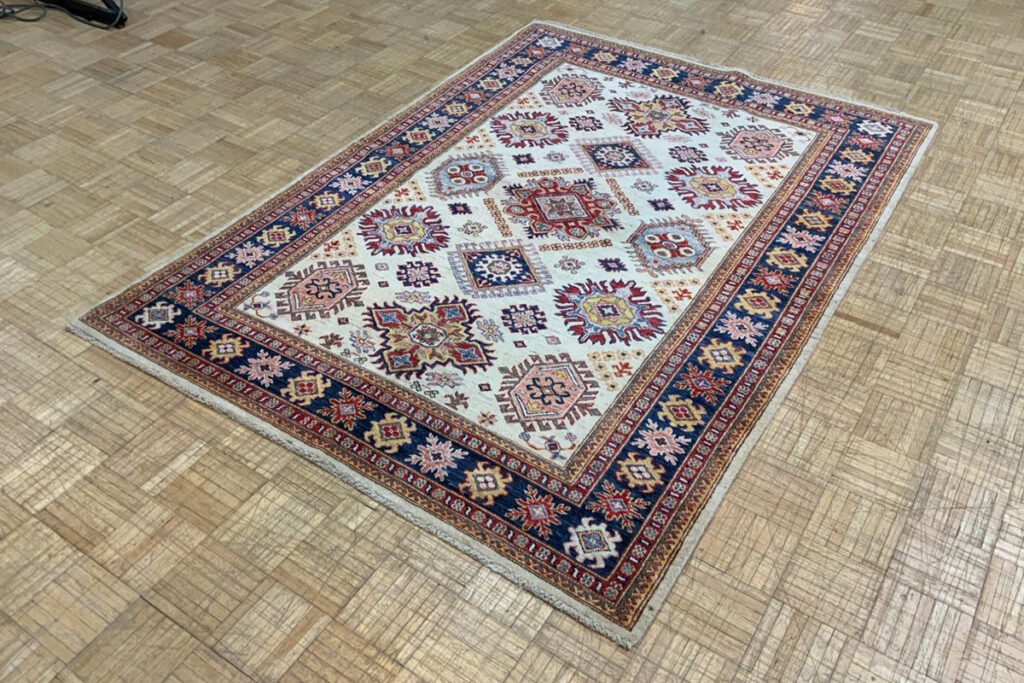 Warm up cool decor with a beautiful Kazak Rug area rug from David Tiftickjian and Sons in Buffalo, NY.