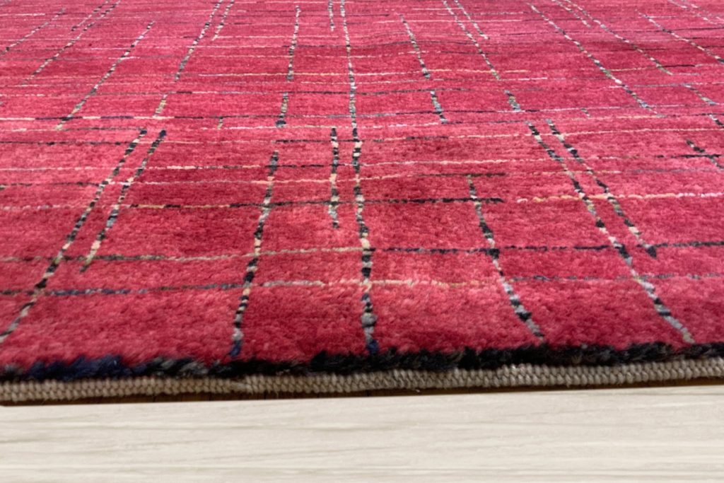 If you enjoy adding patriotic decor to your home, incorporate this Modern Panal red rug that celebrates red, white, and blue. Available at David Tiftickjian & Sons.