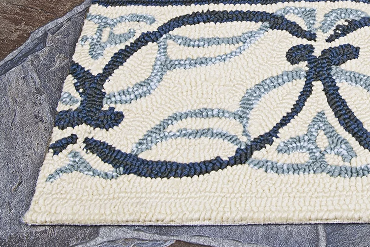 An indoor/outdoor, water-resistant rug like "Covington Pegasus" by Couristan is a multipurpose rug made to resist the elements, mold, and mildew.
