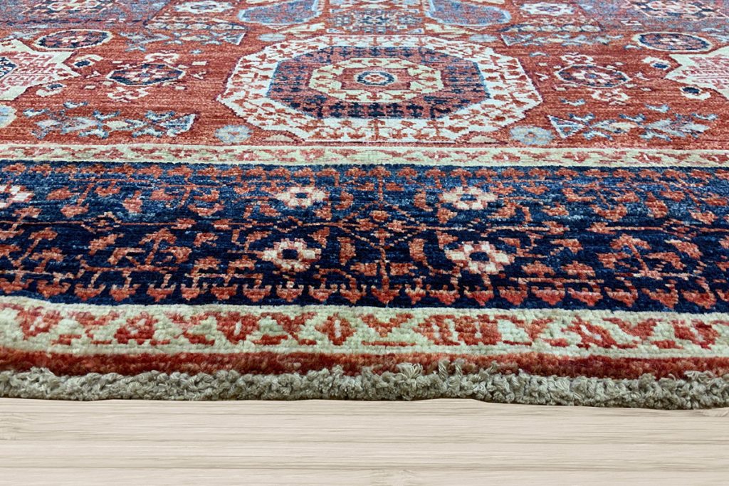 With its large central medallion and intricate geometric motifs, this Mamluk rug is the perfect backdrop for creating memories.