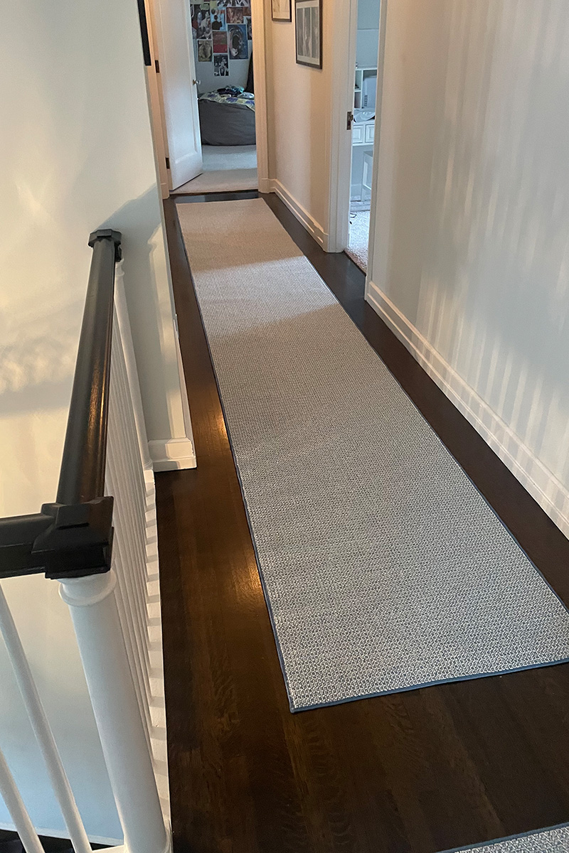 David Tiftickjian & Sons can help you find and install a cohesive area rug, stair runner rug, and hallway runner rug to protect your hardwood flooring.