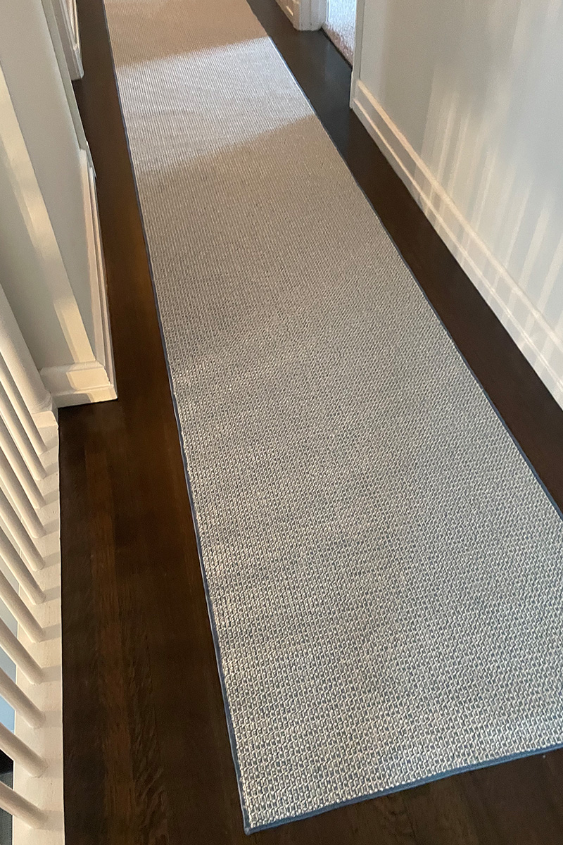 David Tiftickjian & Sons can help you find and install a cohesive area rug, stair runner rug, and hallway runner rug to protect your hardwood flooring.