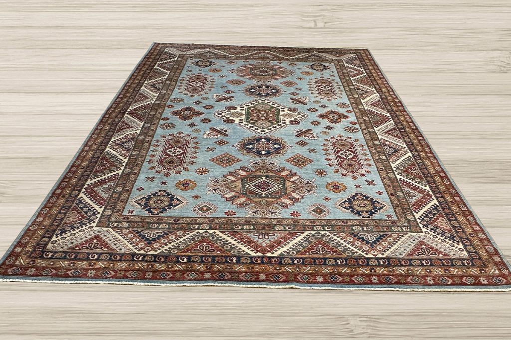 Protect your hardwood flooring from accidental wear-and-tear, increased foot traffic, spills, and stains with a stunning one-of-a-kind Super Kazak rug.