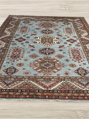 Protect your hardwood flooring from accidental wear-and-tear, increased foot traffic, spills, and stains with a stunning one-of-a-kind Super Kazak rug.