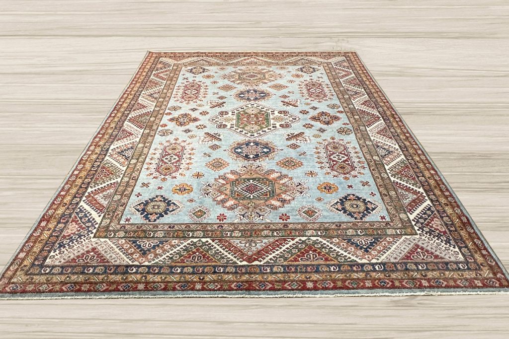 Protect your hardwood flooring from accidental wear-and-tear, increased foot traffic, spills, and stains with a stunning one-of-a-kind Super Kazak rug.