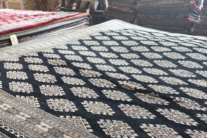 A new black, bokara rug brought in for our 2025 Customer Appreciation Sale.