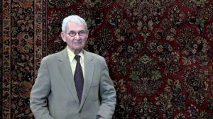 David Tiftickjian Sr standing in front of an oriental rug.