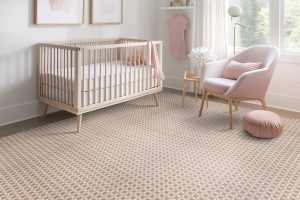 A pink-themed nursery with pink carpet from Stanton as an example of the ideal floor choice for nurseries.