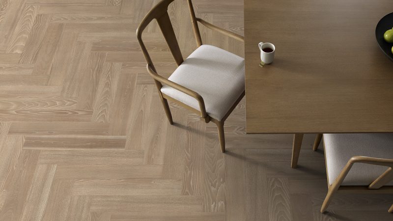 Patterned hardwood flooring like herringbone or chevron is one of the 2026 floor trends that will help enhance your home.