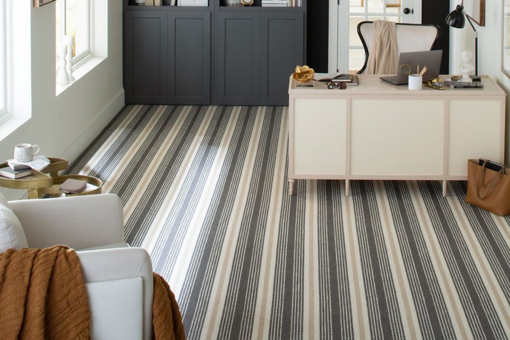 A home office featured a blue and cream striped wall-to-wall carpet from the Karastan Black Label Collection.