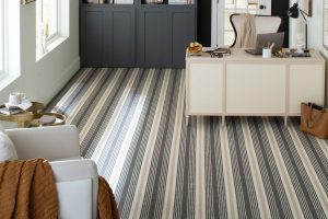 A home office featured a blue and cream striped wall-to-wall carpet from the Karastan Black Label Collection.