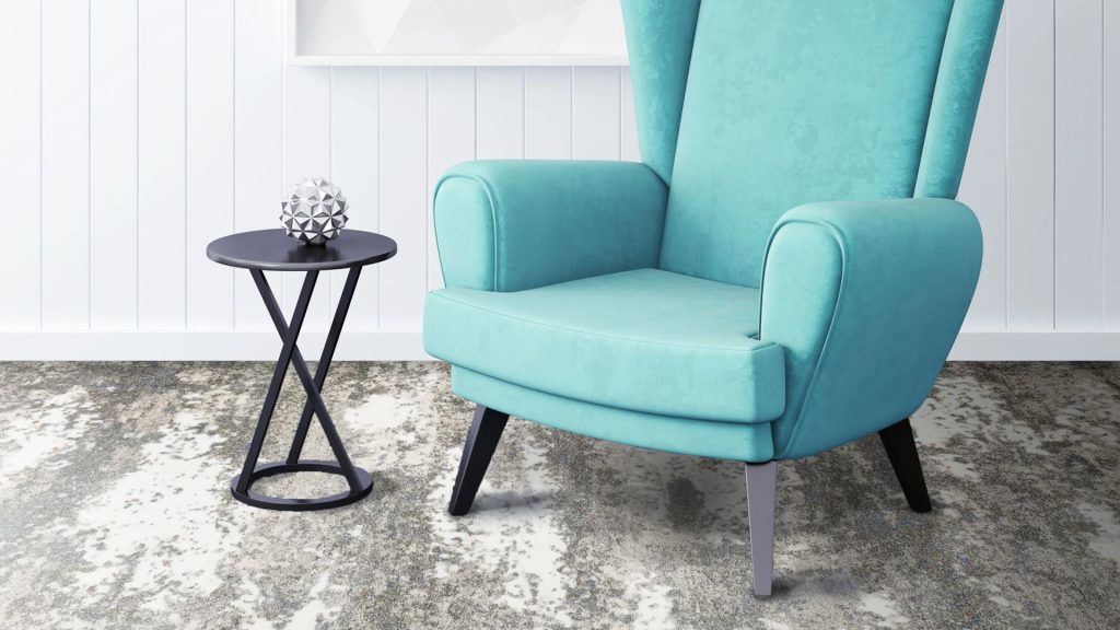 Gray white carpet by Prestige Mills under an aqua chair.