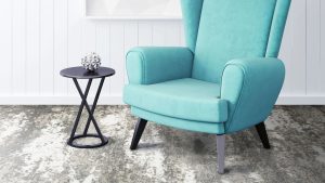 Gray white carpet by Prestige Mills under an aqua chair.
