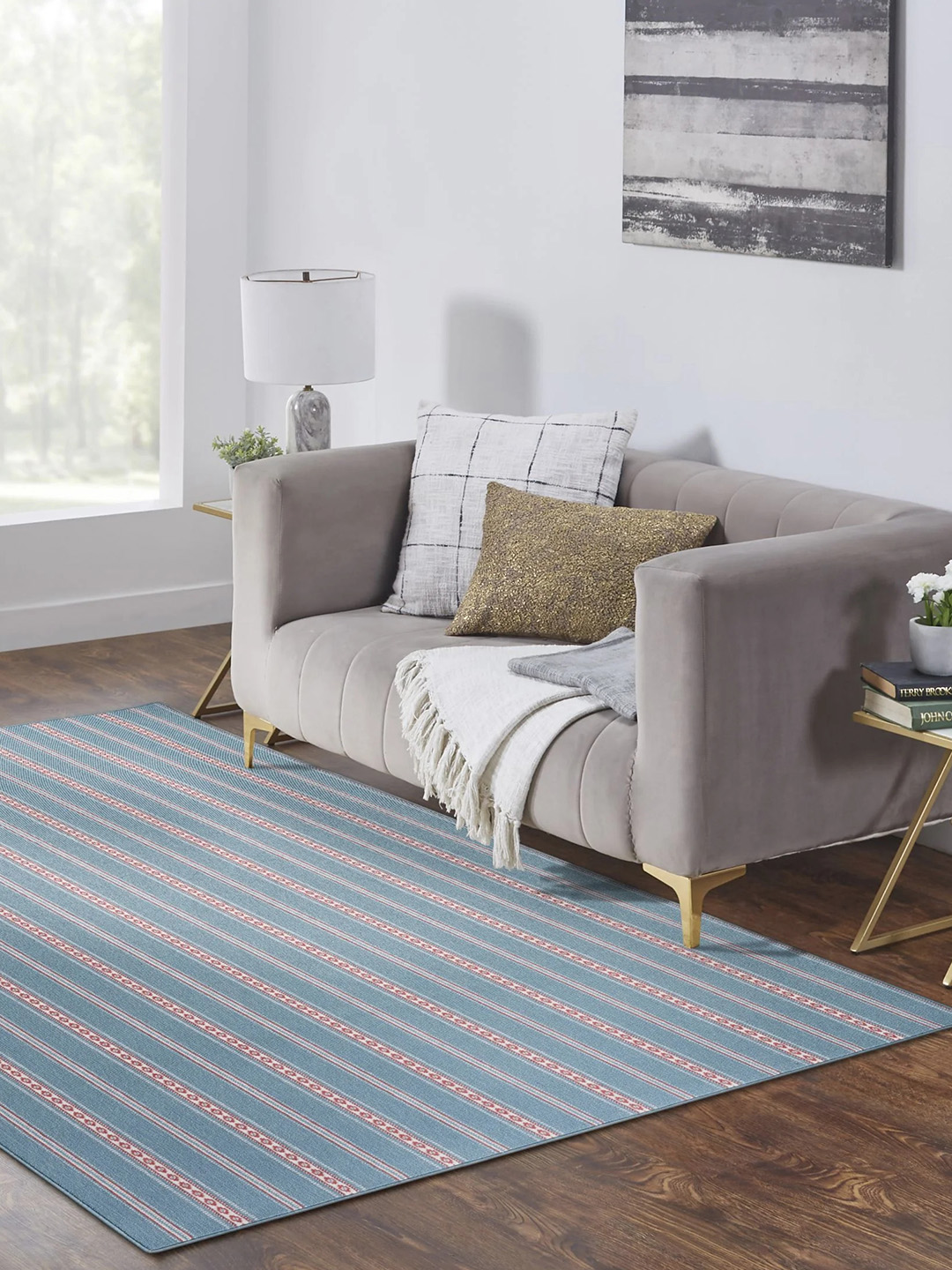 A blue and red striped residential carpet in a living room setting.