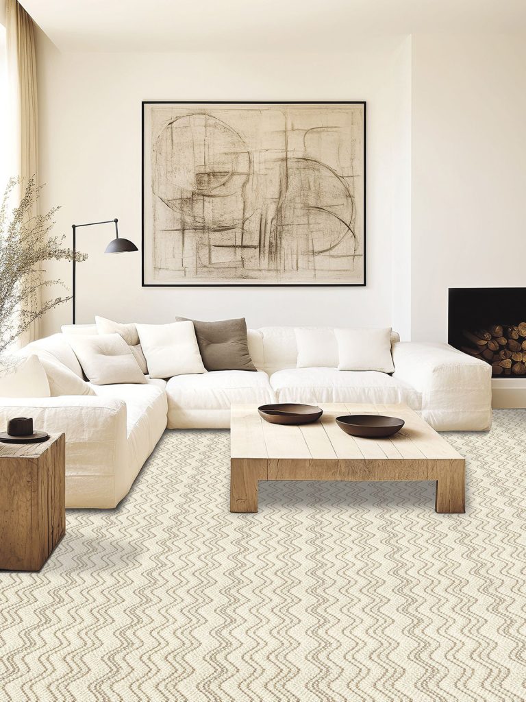 A cream wool carpet with brown wave pattern beneath a white sofa, coffee table, and large abstract painting.
