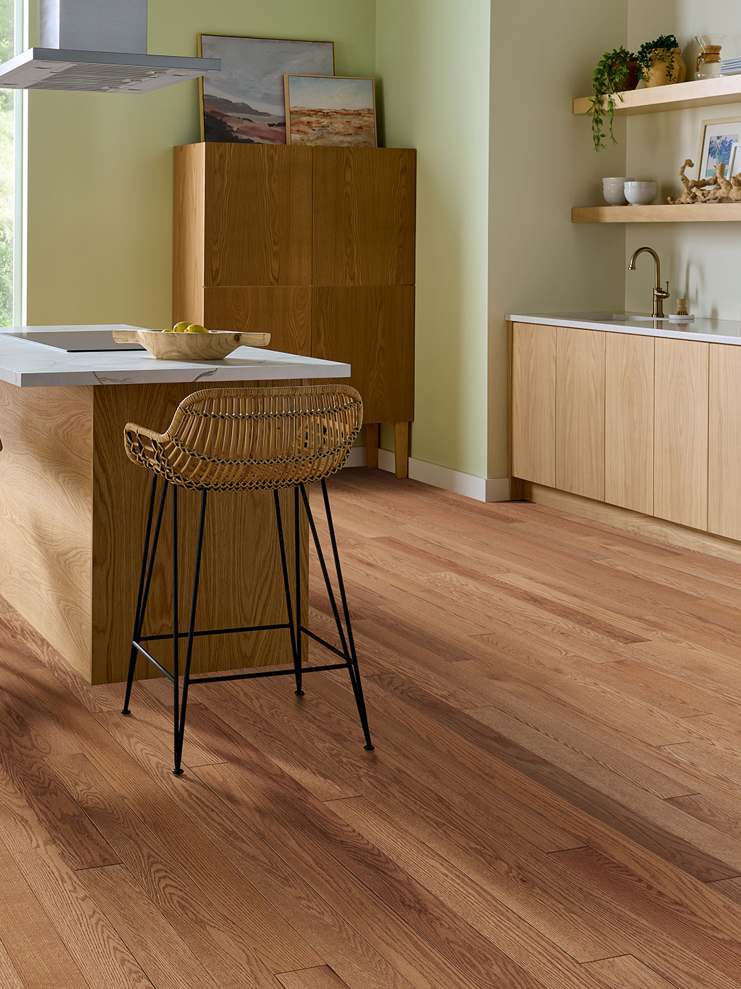 Different shades of hardwood flooring in a kitchen setting.