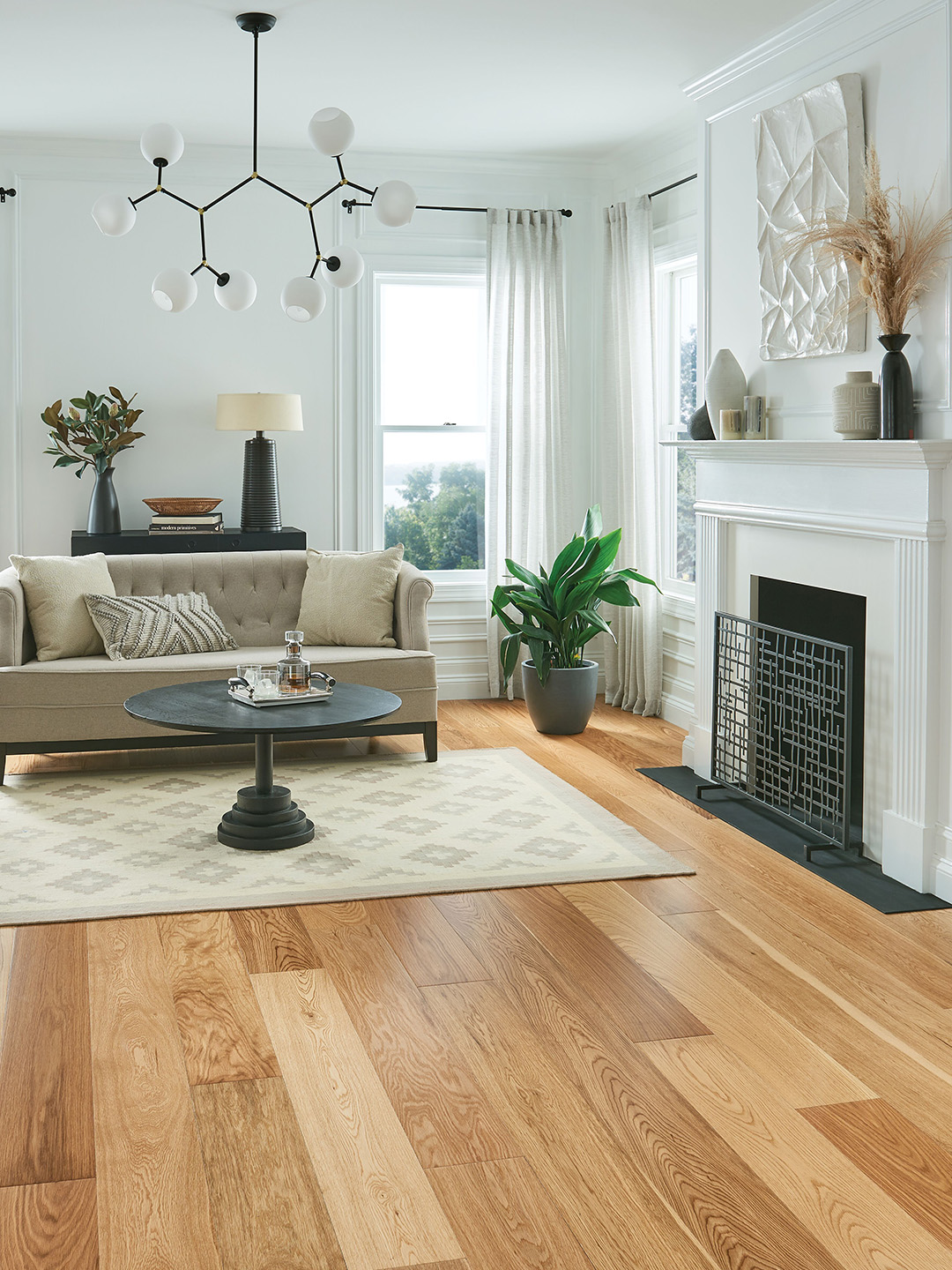 Shades of light hardwood flooring in a living room setting.