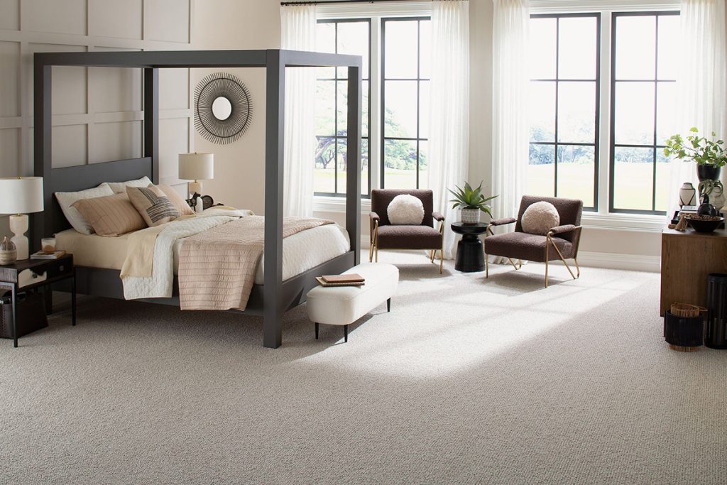 A light colored wool broadloom carpet (Cassian by Karastan Black Label) a bedroom setting.
