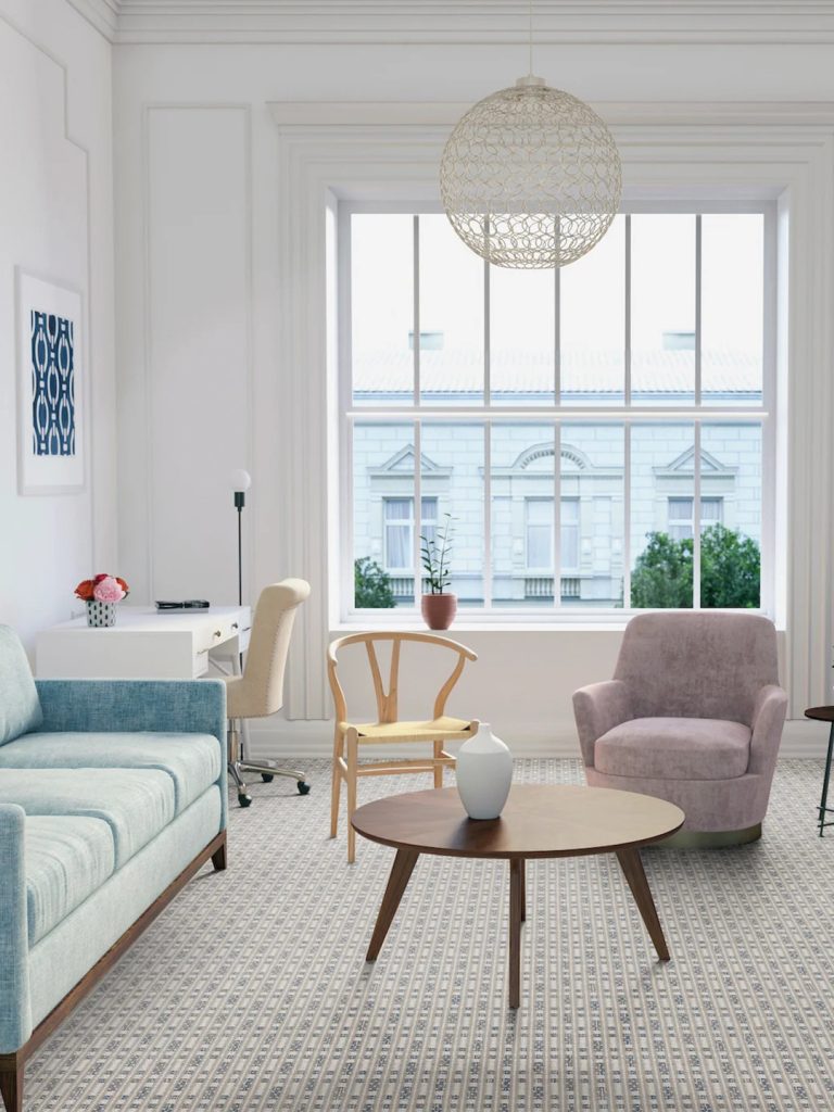 A geometric patterned Masland carpet in a living room setting.