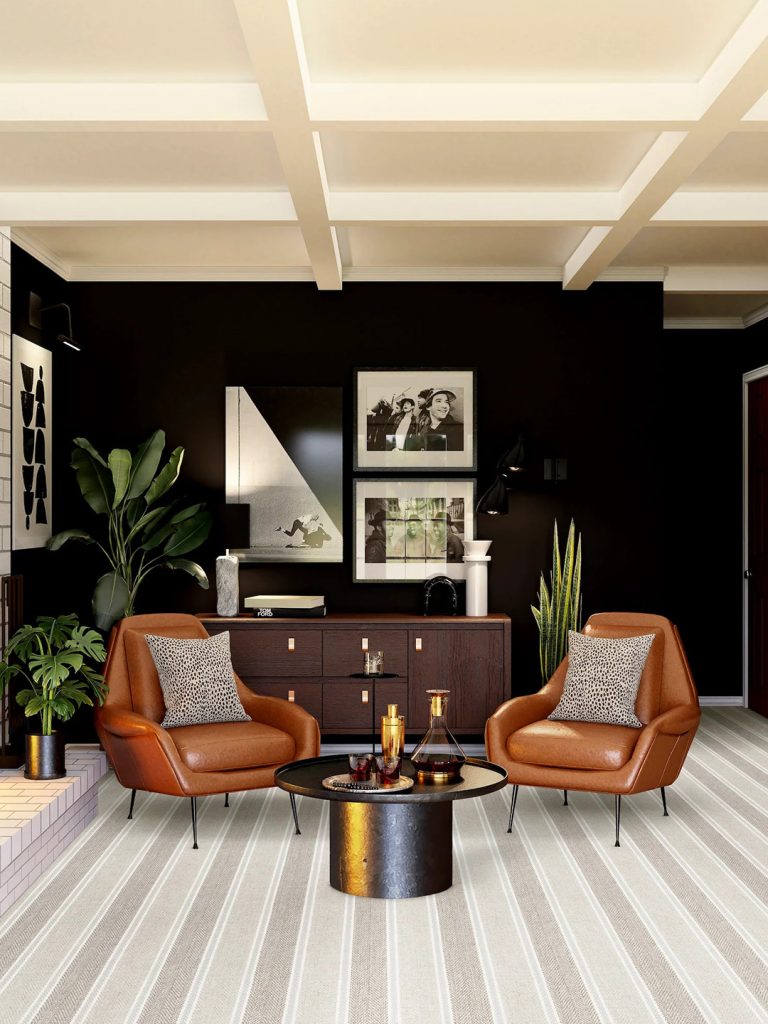 A neutral colored striped Masland carpet in a living room setting with black walls.