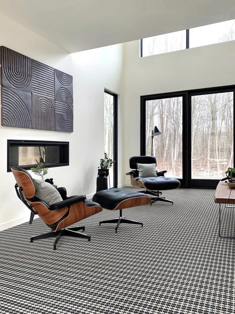 A white and dark blue patterned Masland carpet in a home office setting.