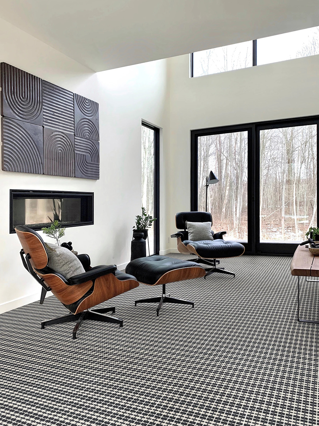 A white and dark blue patterned Masland carpet in a home office setting.