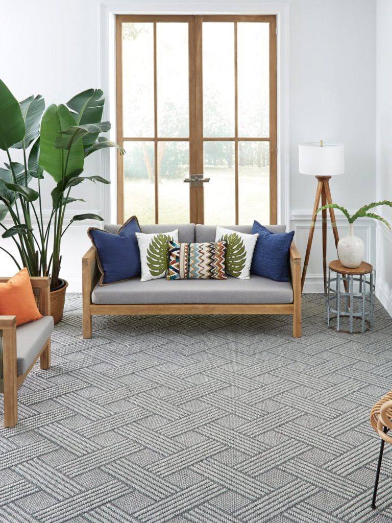 A gray patterned carpet by Masland in a living room setting 